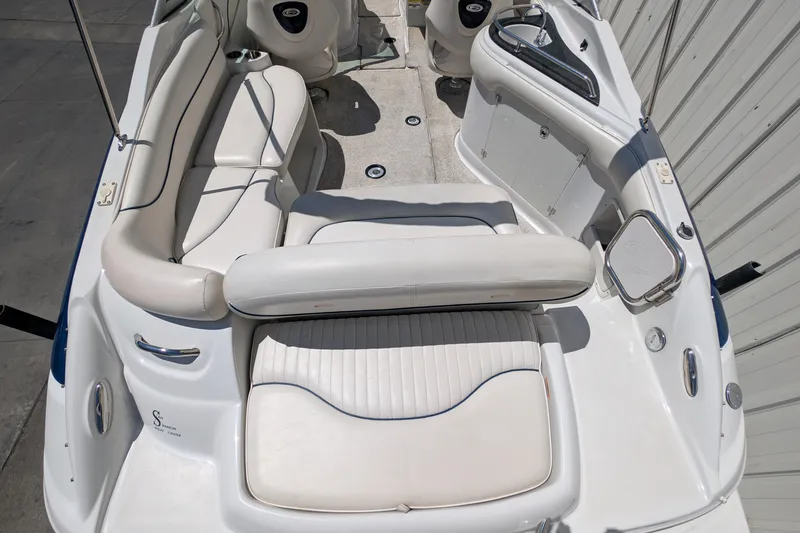 Slide: The Image of 2006 Crownline 240 EX boat interior with white seating and sleek design. - 15