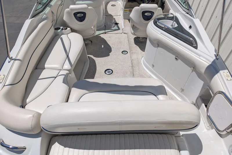 Slide: The Image of 2006 Crownline 240 EX boat interior with white seating and sleek design. - 16