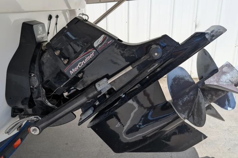Slide: The Image of MerCruiser Bravo Three outdrive on 2006 Crownline 240 EX boat, featuring dual propellers. - 25