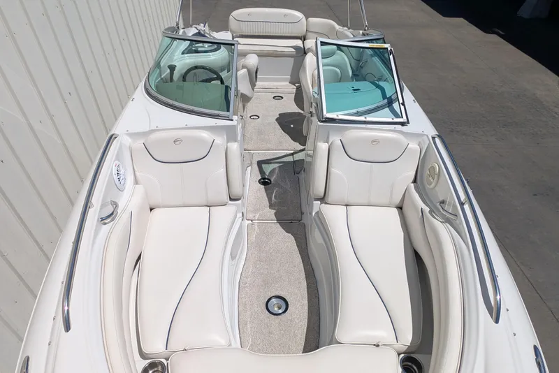 Slide: The Image of 2006 Crownline 240 EX boat interior with white seating and windshield. - 6