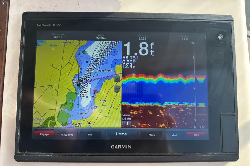 Slide: The Image of Garmin GPS display on 1999 Silverton 442 Cockpit Motor Yacht, showing navigation and sonar data. - 17