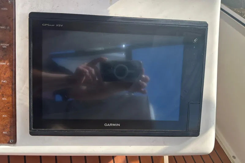 Slide: The Image of Garmin GPSmap XSV on 1999 Silverton 442 Cockpit Motor Yacht dashboard. - 19