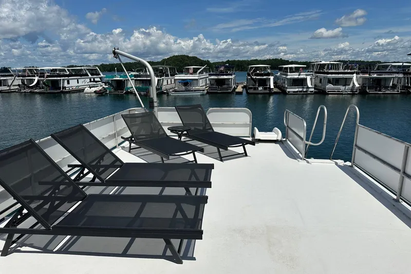 Slide: The Image of Rooftop deck of 1990 Sumerset 14x65 houseboat with lounge chairs, overlooking marina. - 13