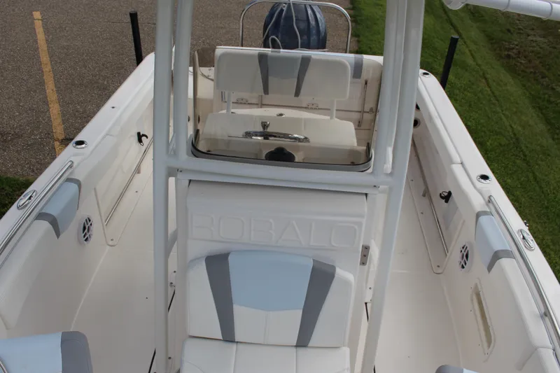 Slide: The Image of 2023 Robalo R222 Center Console boat interior with seating and console view. - 11