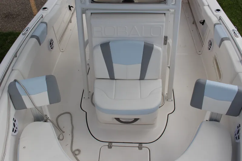 Slide: The Image of 2023 Robalo R222 Center Console boat interior with cushioned seating and sleek design. - 13