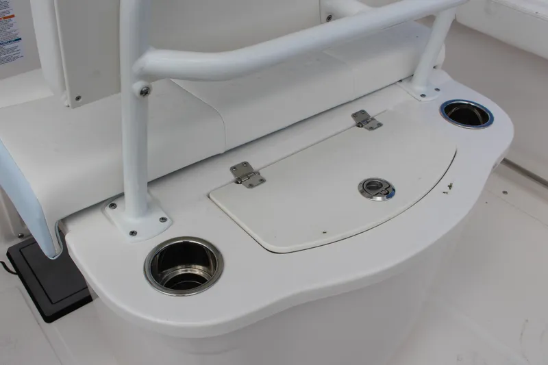 Slide: The Image of 2023 Robalo R222 Center Console boat seat with storage and cup holders. - 16
