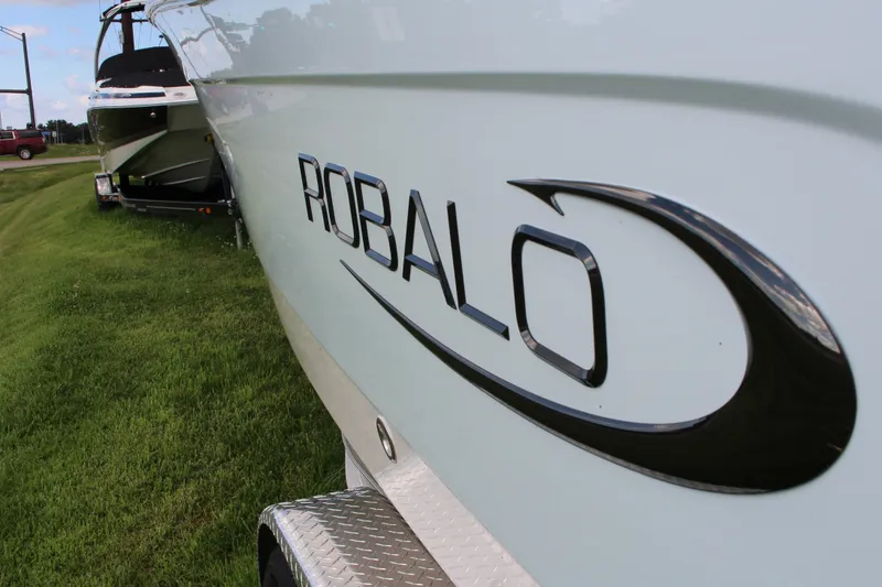 Slide: The Image of 2023 Robalo R222 Center Console boat on trailer, side view. - 19