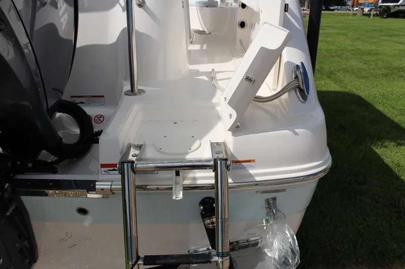 Slide: The Image of 2023 Robalo R222 Center Console boat stern with ladder and engine details. - 29