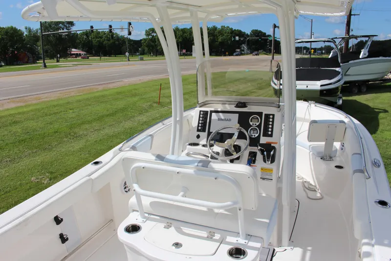 Slide: The Image of 2023 Robalo R222 Center Console boat interior with steering wheel and control panel. - 30