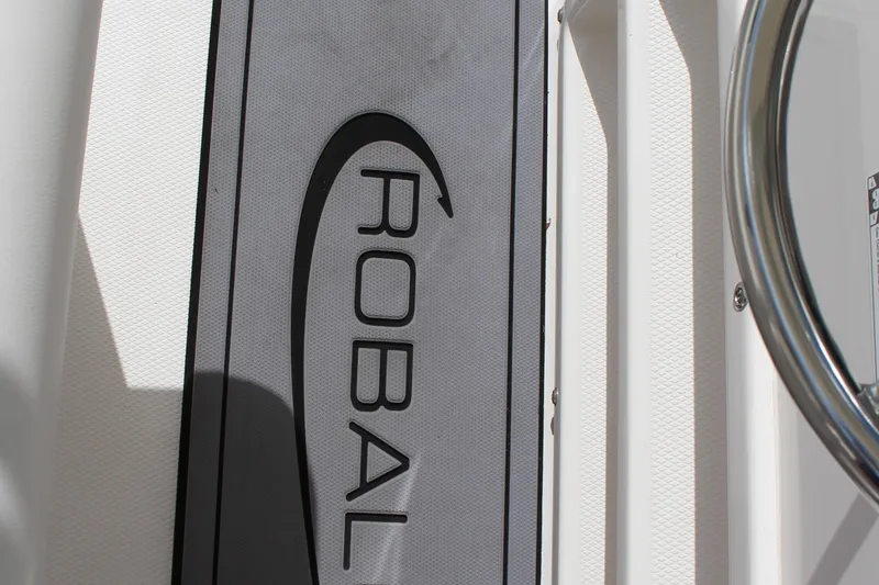 Slide: The Image of 2023 Robalo R222 Center Console logo on boat deck. - 34