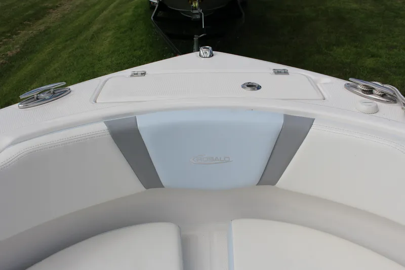 Slide: The Image of 2023 Robalo R222 Center Console boat interior with cushioned seating and deck details. - 8