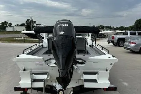 Slide: The Image of 2026 SeaArk ProCat 240 boat with powerful outboard motor, parked outdoors. - 3