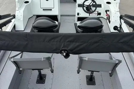 Slide: The Image of 2026 SeaArk ProCat 240 boat interior with seating and steering wheel. - 4