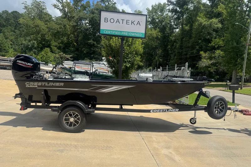 The Image of New 2025 Crestliner 1657 Outlook Stick Steer boat on trailer, displayed outdoors at Boateka of West Georgia. - 0