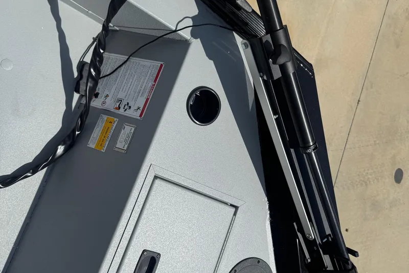 Slide: The Image of 2025 Crestliner 1657 Outlook Stick Steer boat interior with steering controls and seating. - 6