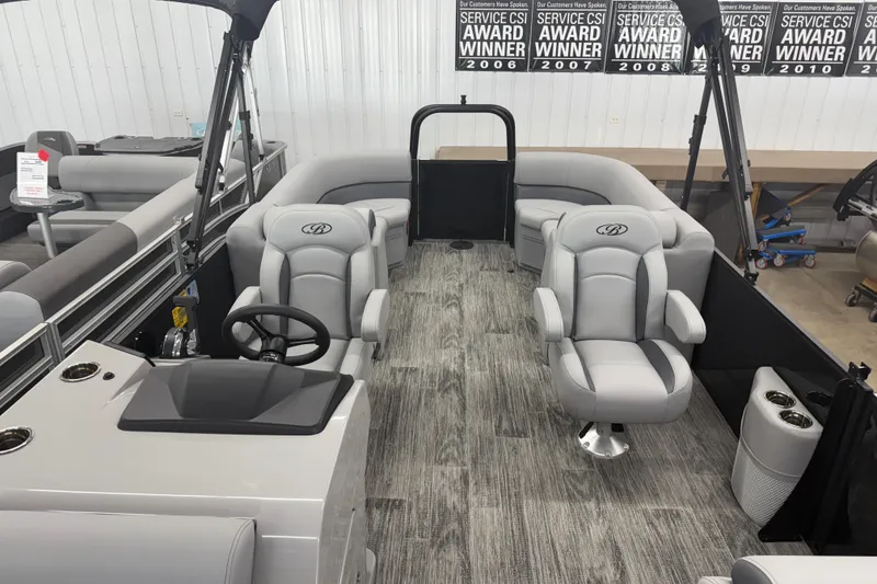 Slide: The Image of 2026 Bentley Pontoons Legacy 243 Navigator interior with luxurious seating and modern design. - 10