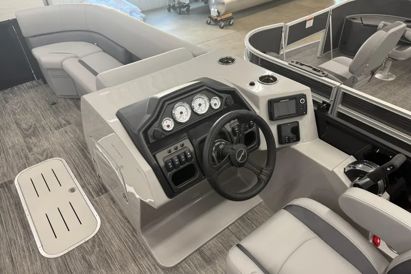 Slide: The Image of 2026 Bentley Pontoons Legacy 243 Navigator interior with modern dashboard and seating. - 13
