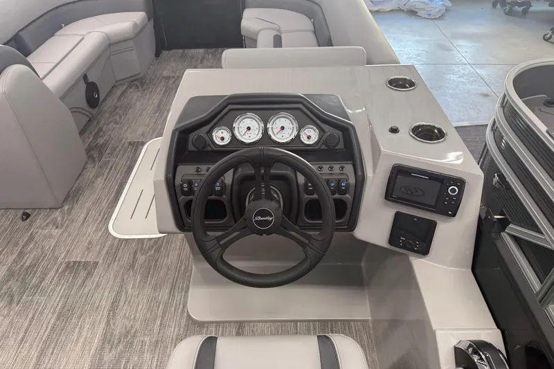 Slide: The Image of 2026 Bentley Pontoons Legacy 243 Navigator dashboard with steering wheel and gauges. - 14
