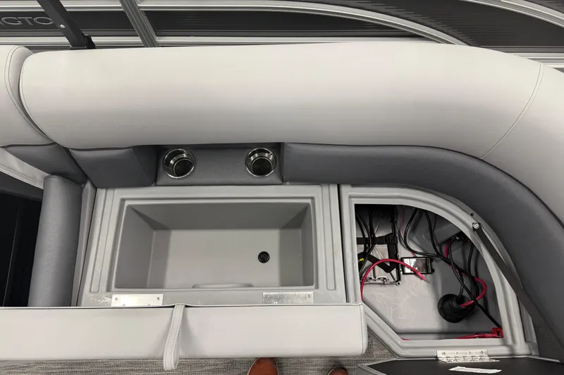 Slide: The Image of 2026 Bentley Pontoons Legacy 243 Navigator interior with storage compartment and wiring. - 19