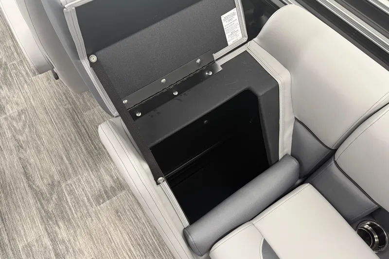 Slide: The Image of 2026 Bentley Pontoons Legacy 243 Navigator seat storage compartment, open on a pontoon boat. - 20