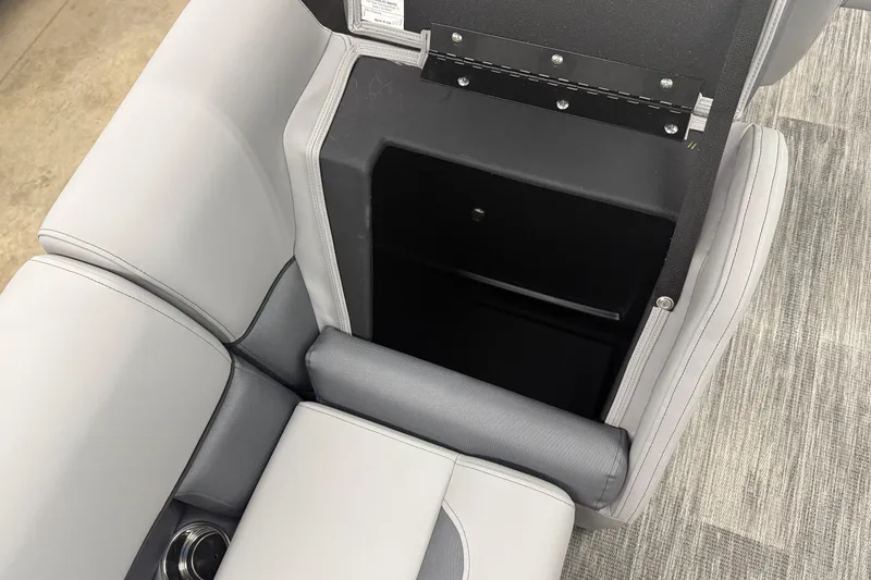 Slide: The Image of 2026 Bentley Pontoons Legacy 243 Navigator seat storage compartment, open with gray upholstery. - 22