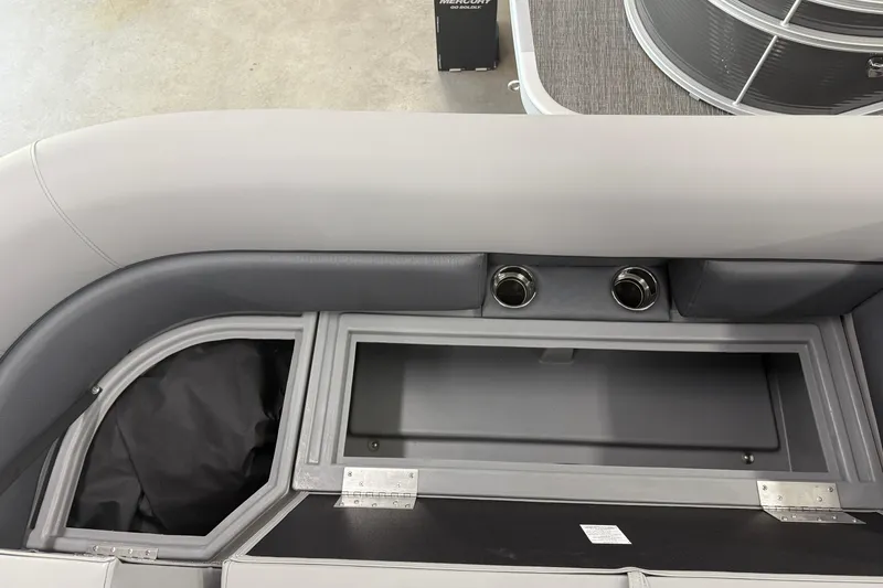 Slide: The Image of 2026 Bentley Pontoons Legacy 243 Navigator interior storage compartment and seating detail. - 25