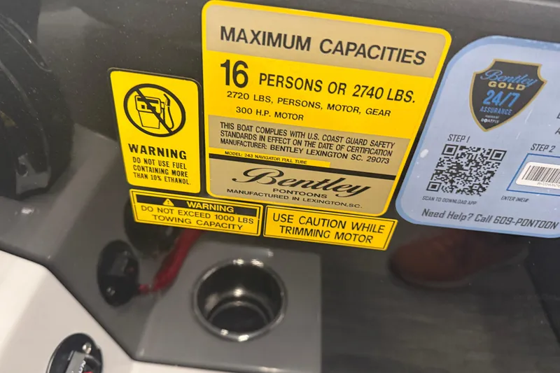 Slide: The Image of 2026 Bentley Pontoons Legacy 243 Navigator capacity and safety warning labels. - 26