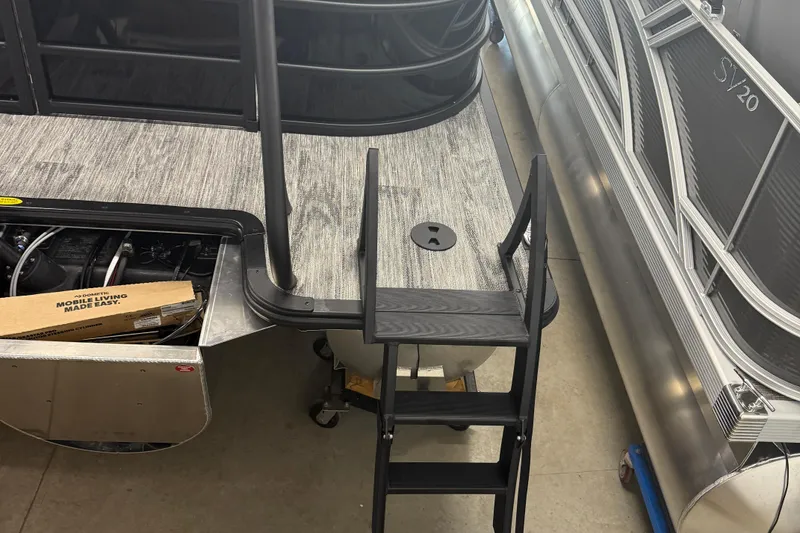 Slide: The Image of Bentley Pontoons Legacy 243 Navigator 2026 with ladder and storage compartment. - 4