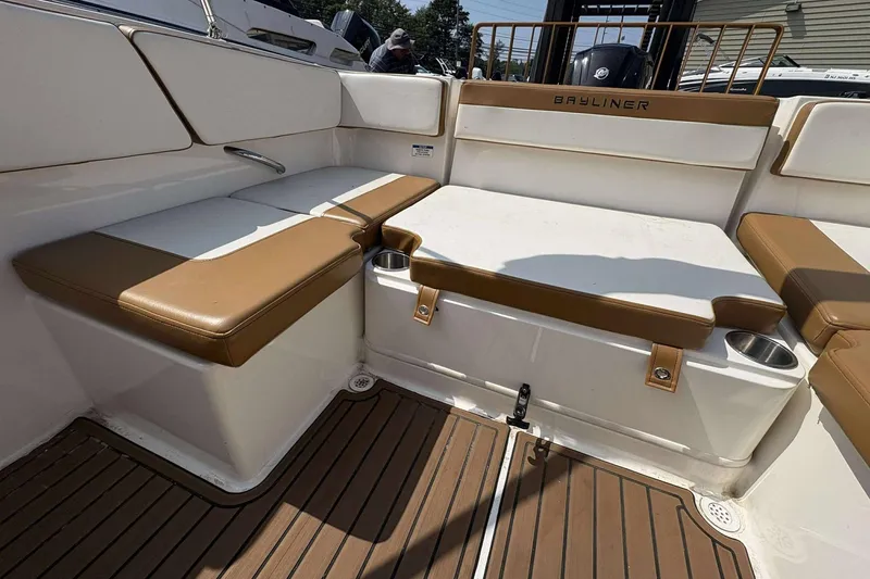 Slide: The Image of 2020 Bayliner VR4 Bowrider OB interior with cushioned seating and cup holders. - 11
