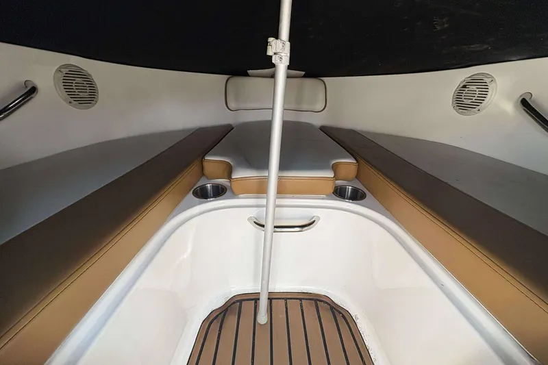Slide: The Image of 2020 Bayliner VR4 Bowrider OB interior with cushioned seating and cup holders. - 12