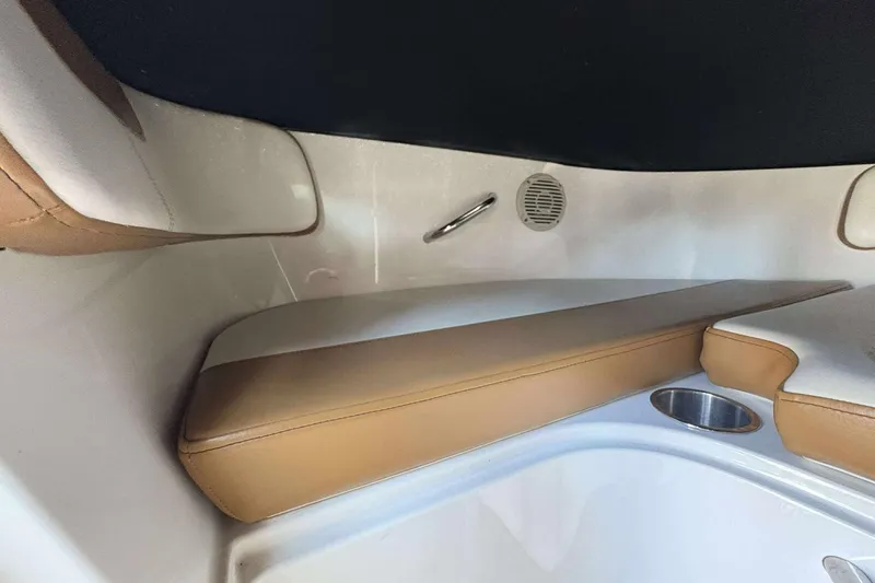 Slide: The Image of 2020 Bayliner VR4 Bowrider OB interior seating with tan cushions and cup holder. - 13
