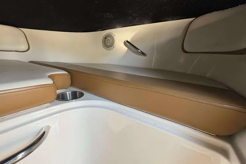 Slide: The Image of 2020 Bayliner VR4 Bowrider OB interior with tan seating and cup holder. - 14