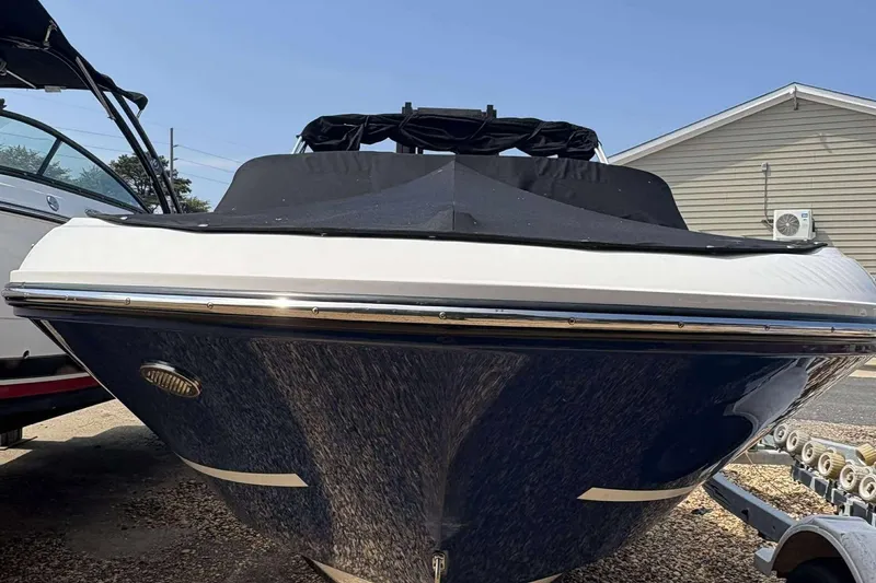 Slide: The Image of 2020 Bayliner VR4 Bowrider OB boat with cover, parked on trailer. - 3