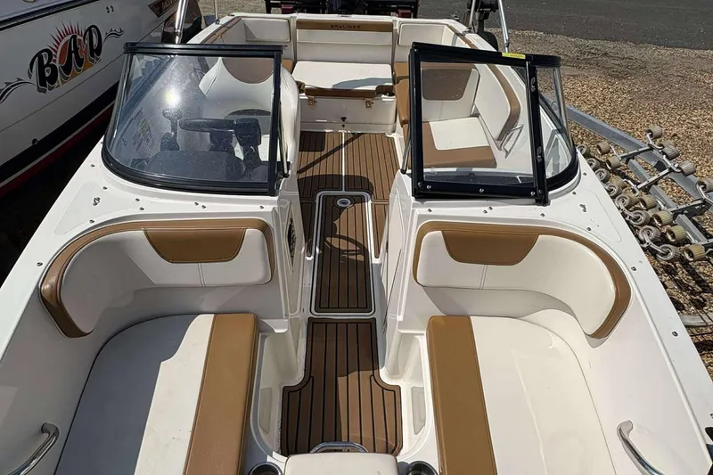 Slide: The Image of 2020 Bayliner VR4 Bowrider OB with tan and white interior, open cockpit view. - 7