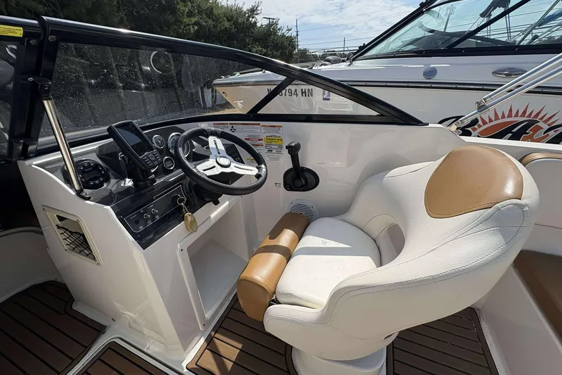 Slide: The Image of 2020 Bayliner VR4 Bowrider OB cockpit with steering wheel and control panel. - 8