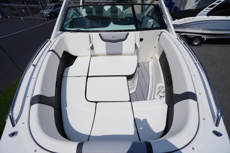 Slide: The Image of 2025 Chaparral 280 OSX boat interior with luxurious white seating and modern design. - 17