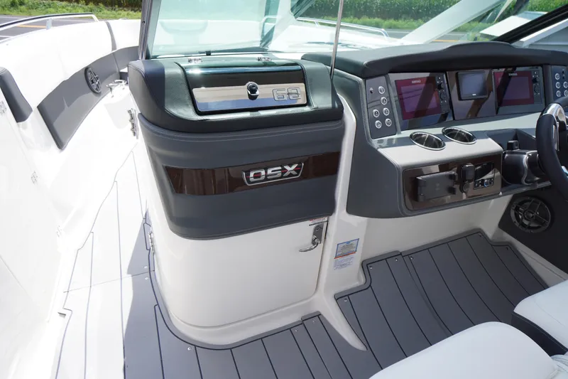 Slide: The Image of 2025 Chaparral 280 OSX boat dashboard with modern controls and sleek design. - 25