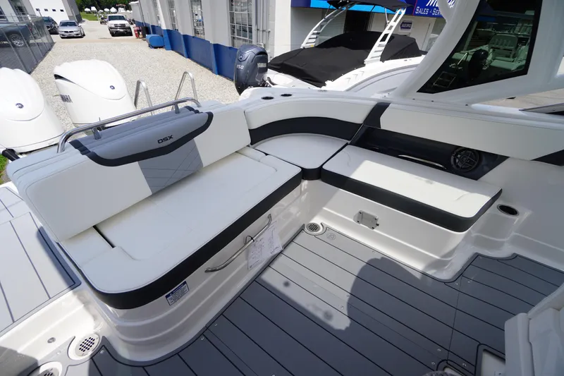 Slide: The Image of 2025 Chaparral 280 OSX boat interior with sleek seating and modern design. - 32