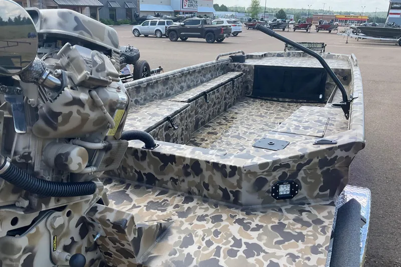 Slide: The Image of Camouflage-patterned 2026 Excel 1754 F4 Shallow Water boat parked outdoors. - 3