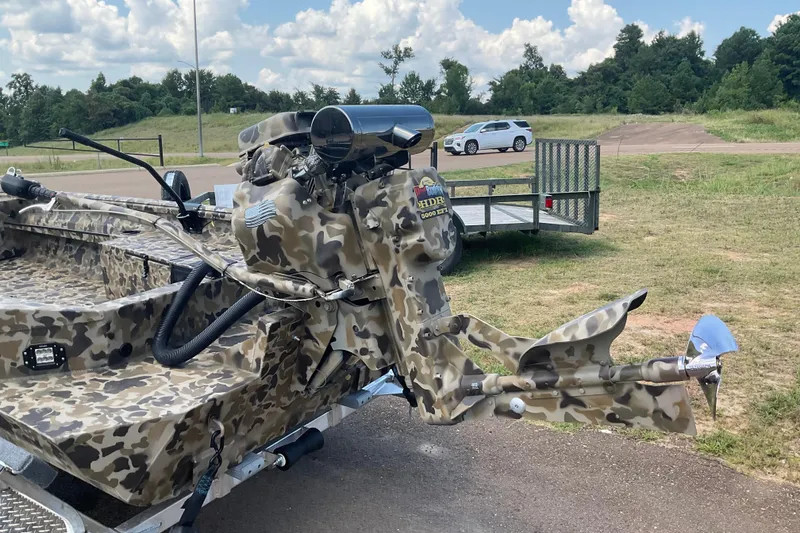 Slide: The Image of 2026 Excel 1754 F4 Shallow Water boat with camouflage design and powerful motor. - 4