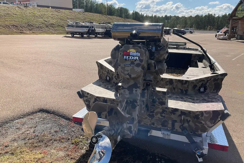 Slide: The Image of Camouflage-patterned 2026 Excel 1754 F4 Shallow Water boat with powerful engine, outdoors. - 5