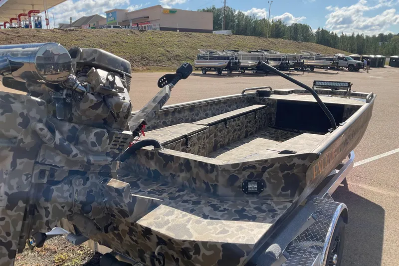 Slide: The Image of Camouflage-patterned 2026 Excel 1754 F4 Shallow Water boat with powerful engine on display. - 6