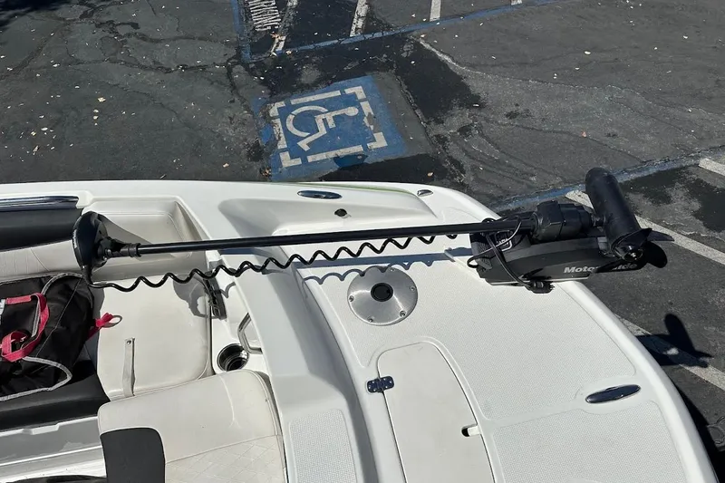Slide: The Image of 2019 Tahoe 2150 boat with trolling motor in parking lot. - 23