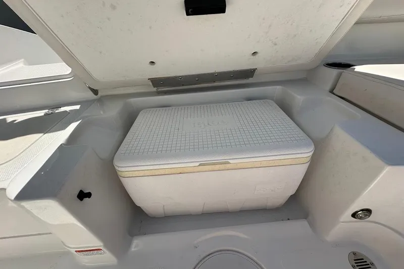 Slide: The Image of 2019 Tahoe 2150 boat storage compartment with cooler inside. - 31