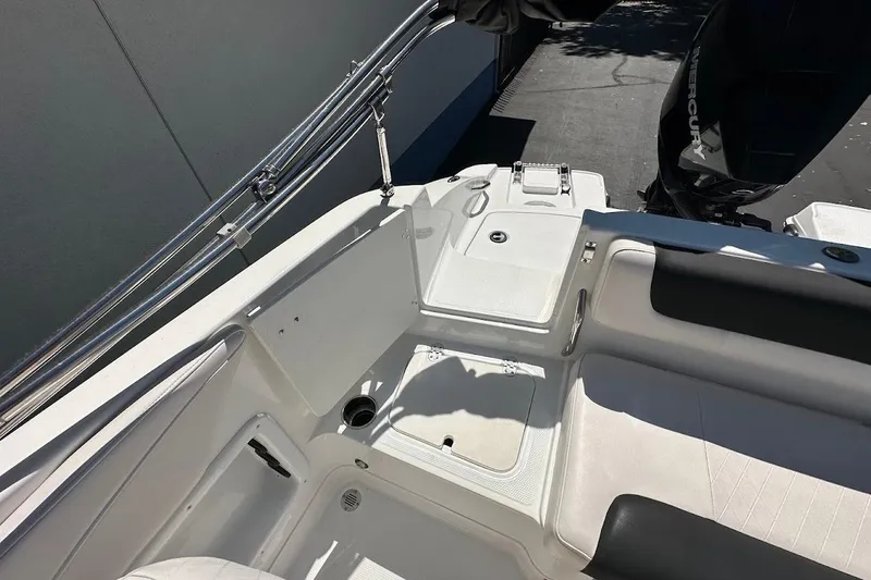 Slide: The Image of 2019 Tahoe 2150 boat interior with seating and Mercury outboard motor. - 34