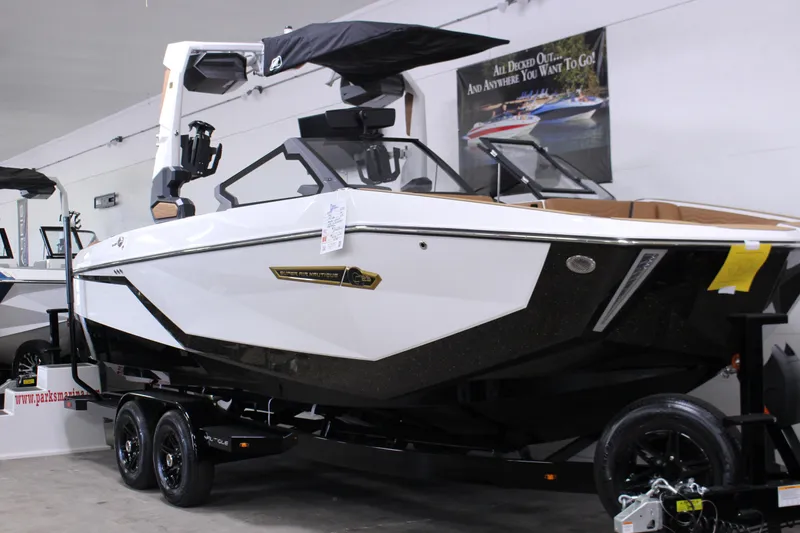 The Image of 2025 Nautique Super Air G23 boat in showroom, featuring sleek design and modern features. - 1