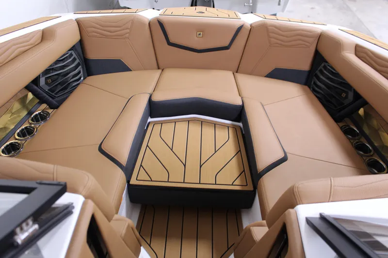 Slide: The Image of Luxurious interior of 2025 Nautique Super Air G23 boat with tan leather seating. - 13