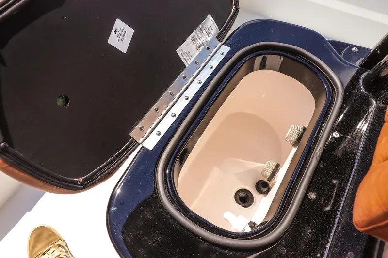 Slide: The Image of Open storage compartment in 2026 Avid 23 Fusion boat, showcasing interior details. - 19
