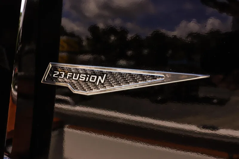 Slide: The Image of Avid 23 Fusion 2026 emblem on a glossy black surface. - 20