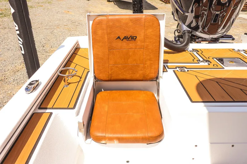 Slide: The Image of 2026 Avid 23 Fusion boat seat with tan leather upholstery and sleek design. - 26